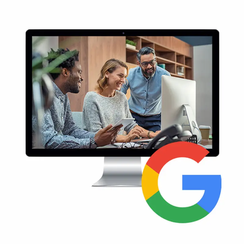 A desktop computer monitor displaying three diverse professionals collaborating in a modern office, overlaid with a large Google logo in the bottom right corner, representing Spring Creative’s search infrastructure services.